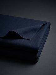The Midnight Navy — collar close-up with single button band collar detail