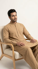 The Camel — seated lifestyle shot on wooden armchair
