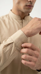 The Camel — cuff and band collar close-up detail