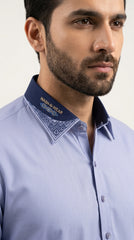 The Periwinkle Blue — navy contrast collar with geometric embroidery close-up