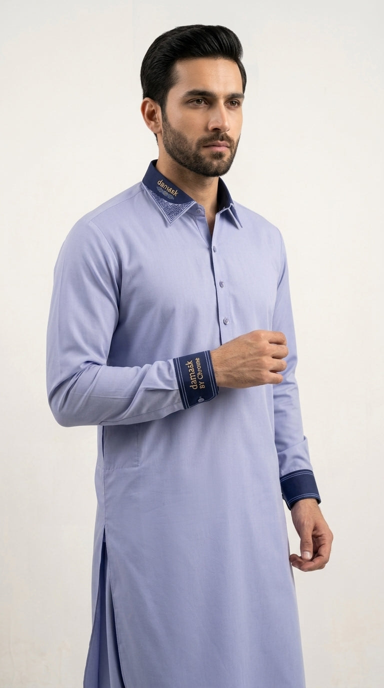 The Periwinkle Blue — three-quarter view showing contrast cuffs and collar