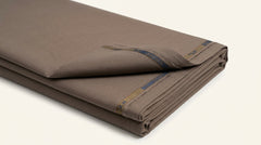 The Warm Mocha — folded fabric yardage showing selvedge label and weave