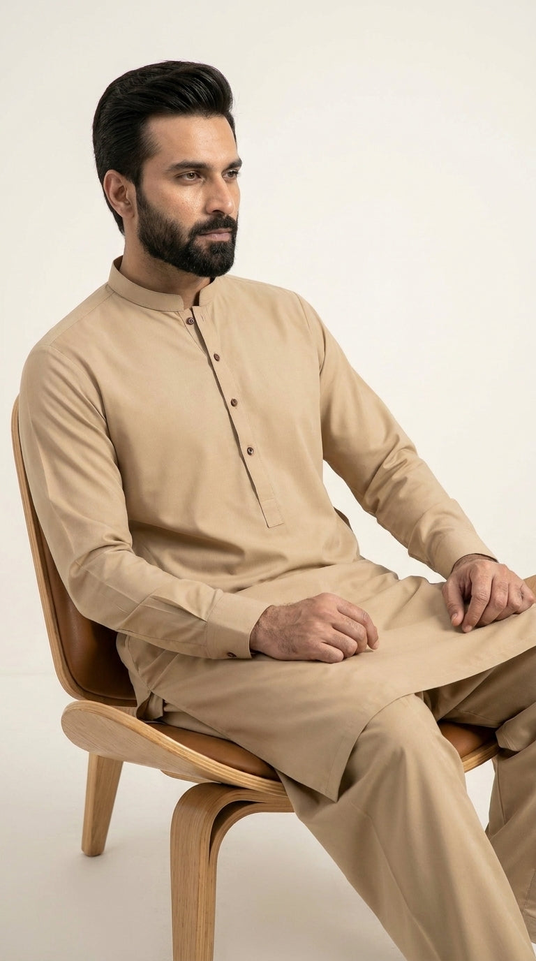 The Camel Sand — seated lifestyle shot styled as kurta shalwar