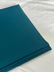The Deep Teal — folded fabric yardage showing matte finish and selvedge