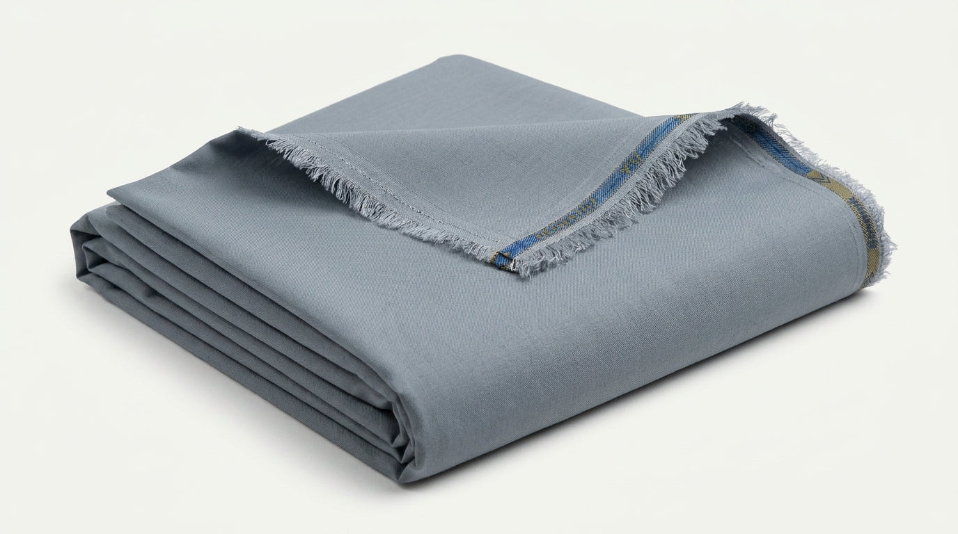 The Steel Grey — folded fabric yardage showing selvedge and weave