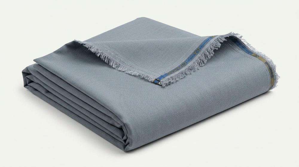 The Steel Grey — folded fabric yardage showing selvedge and weave