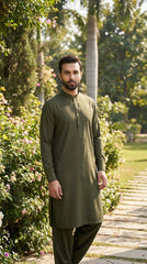 The Olive Regiment — styled as kurta shalwar in garden setting