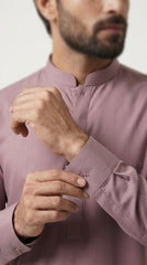 The Dusty Rose — walking three-quarter view showing full kurta shalwar silhouette