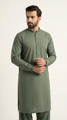 The Pista Green — three-quarter standing view with hands clasped