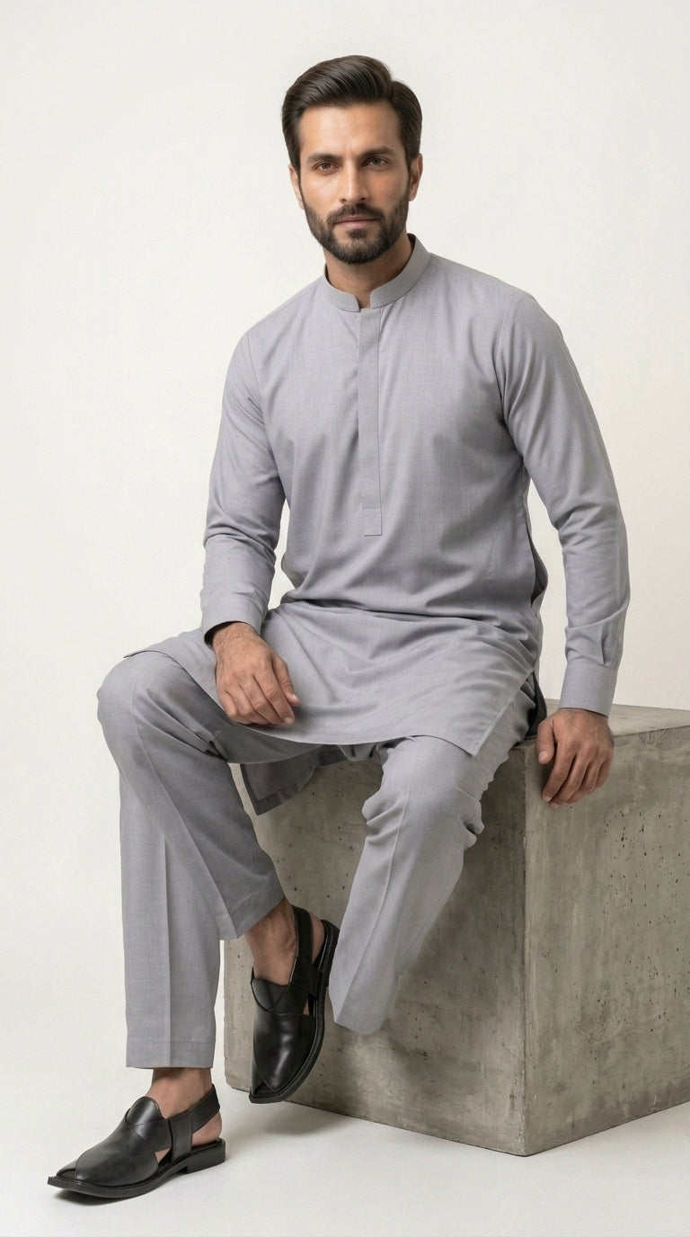 The Silver Grey — seated lifestyle shot on concrete block