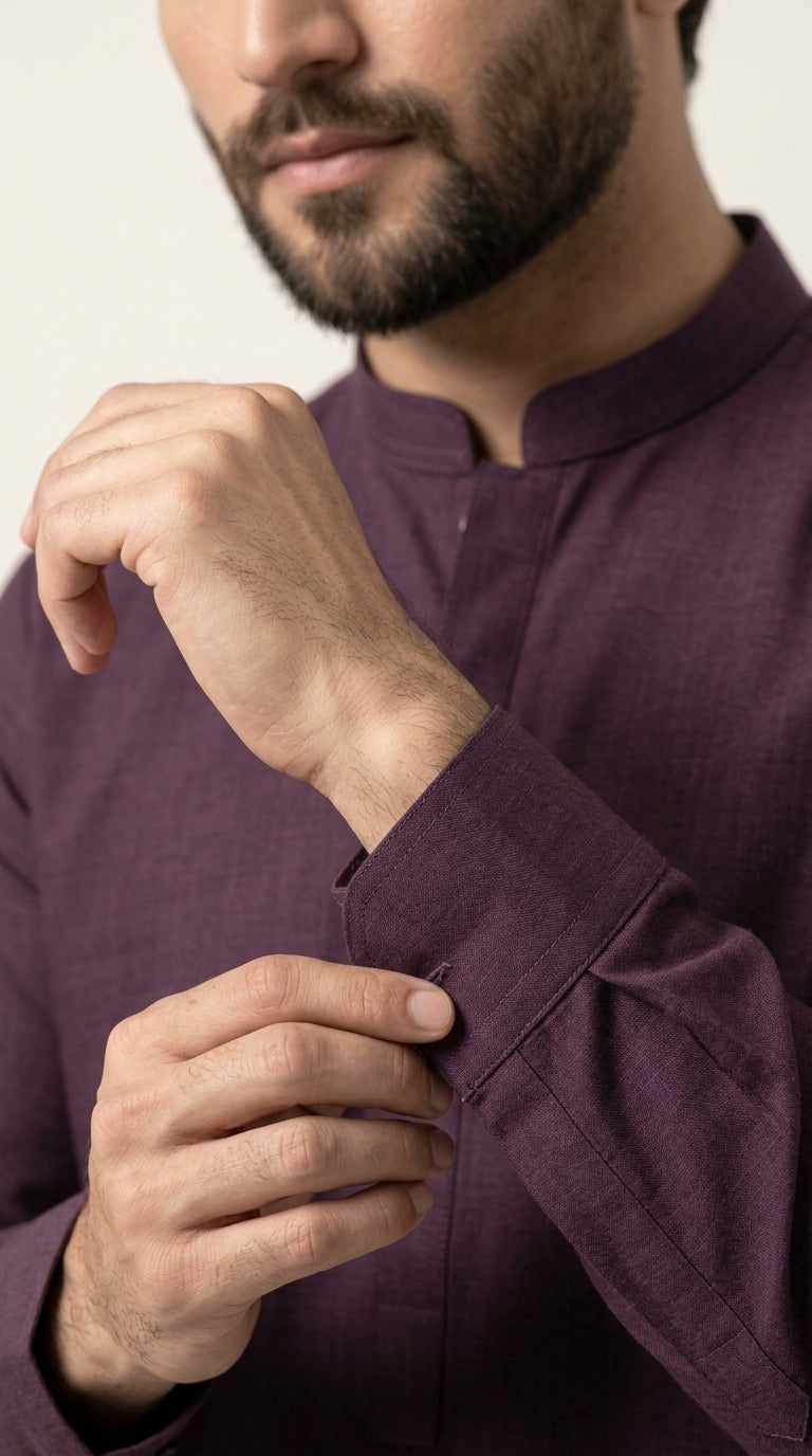The Mid Purple — seated lifestyle shot on concrete block with kurta trouser
