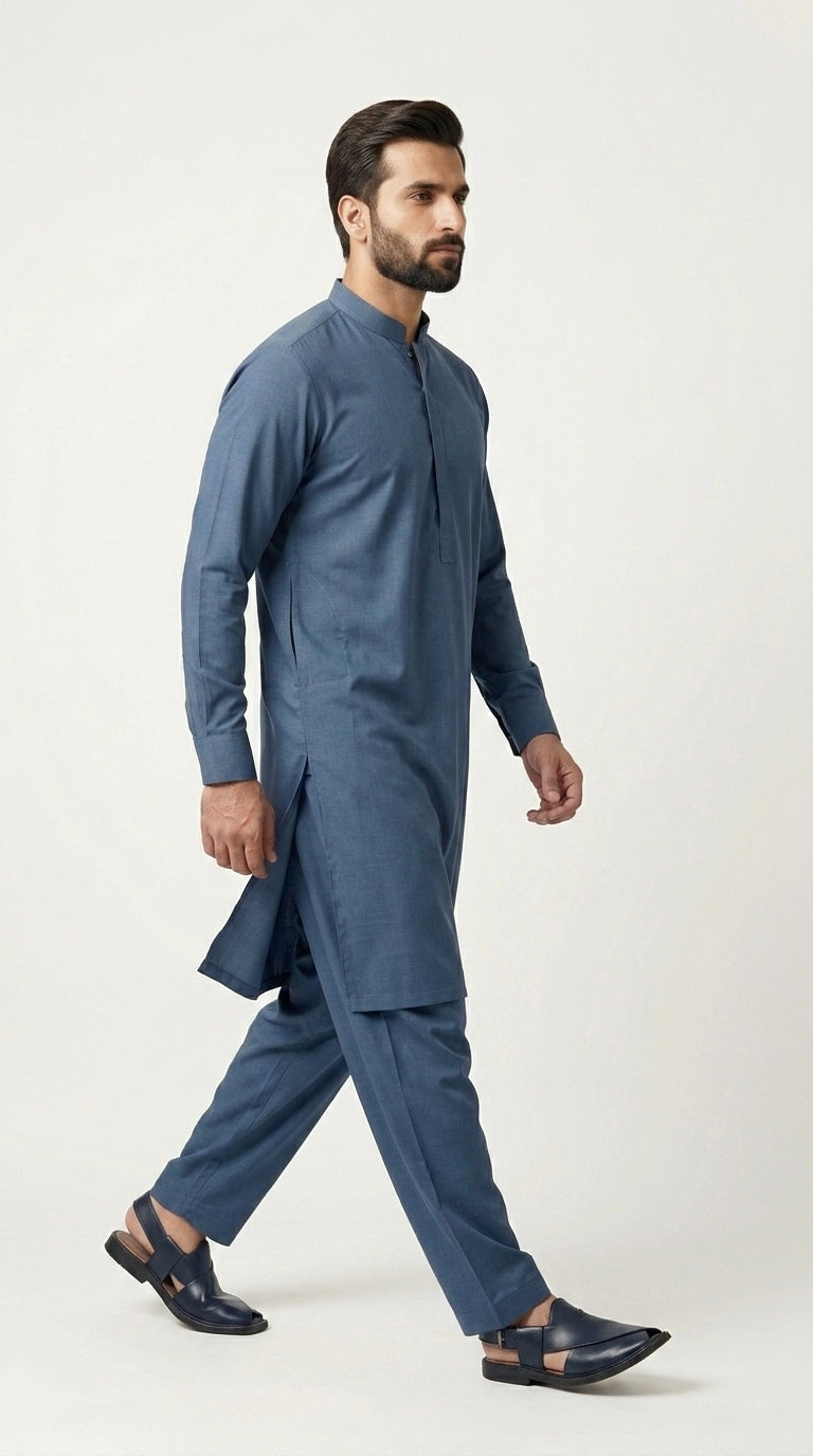 The Steel Blue — full front standing view with hand in pocket