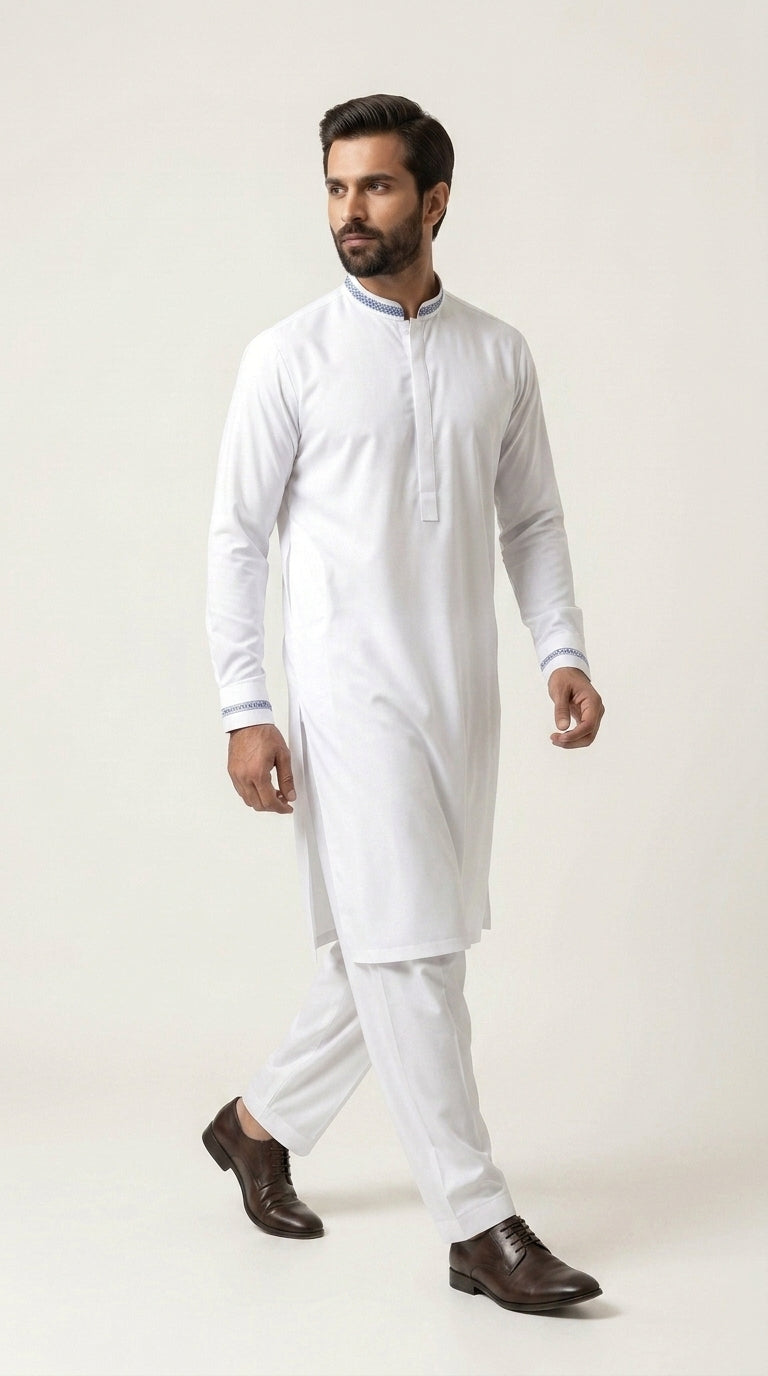 The Pure White — walking three-quarter view showing full kurta shalwar silhouette