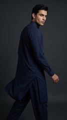 The Midnight Navy — seated editorial shot on wooden chair