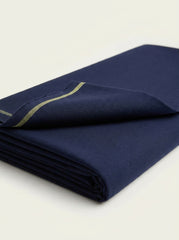 The Navy Blue — folded fabric yardage with gold-stripe selvedge label