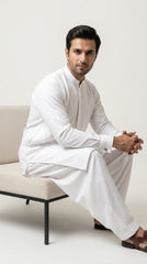 The Pure White — seated lifestyle shot on minimal sofa