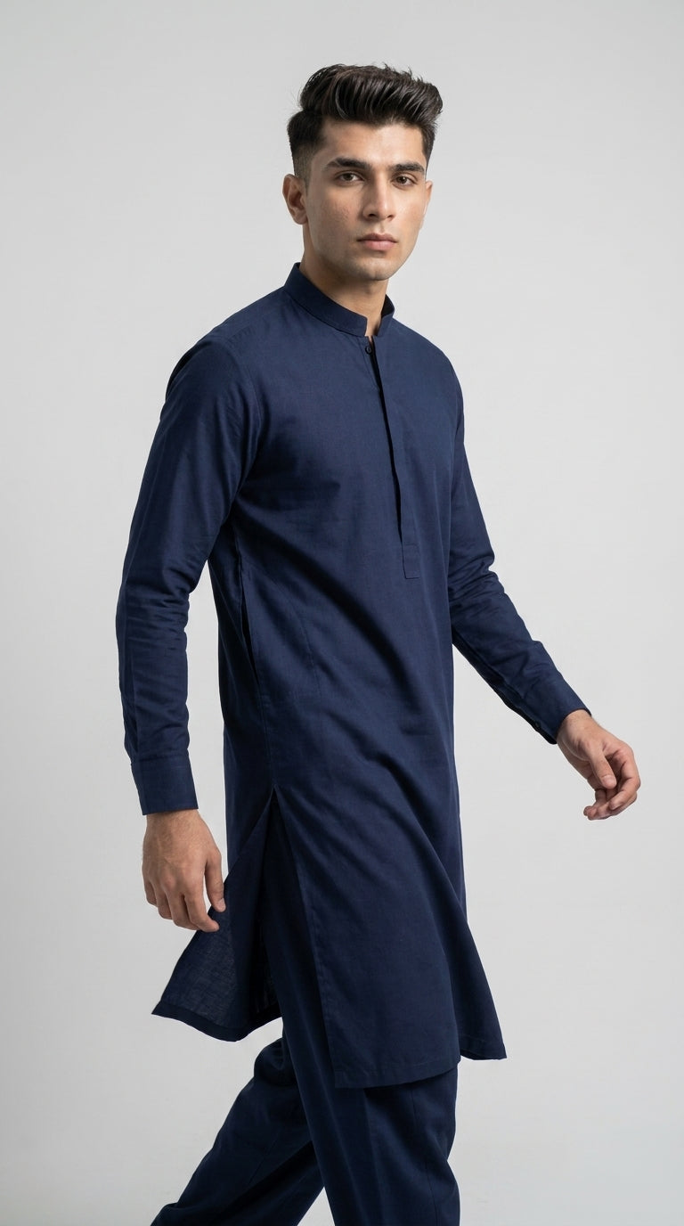 The Navy Blue — three-quarter walking view showing drape and silhouette
