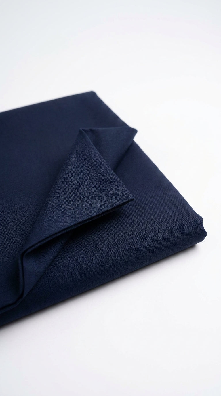 The Navy Blue — folded fabric yardage showing matte finish and depth