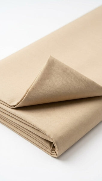 The Camel — folded fabric yardage showing clean matte weave