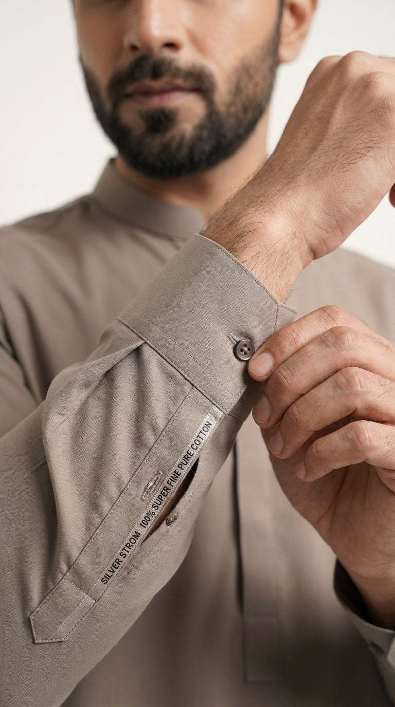 Dusk Brown — cuff detail with fabric label