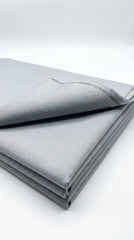 The Royal Silver — folded fabric yardage showing subtle sheen and weave