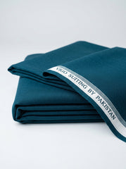 Vigo Star Teal Blue fabric folded with Vigo Suiting by Pakistan selvedge tape