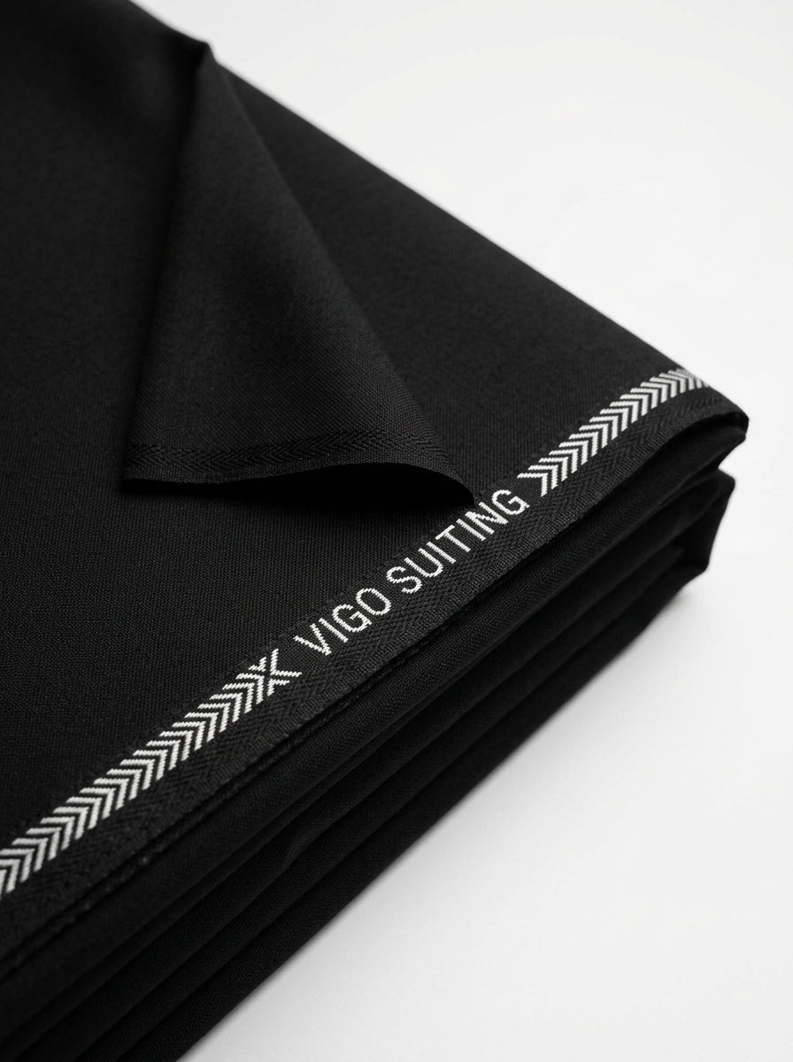 Vigo Star Jet Black fabric close-up with selvedge tape